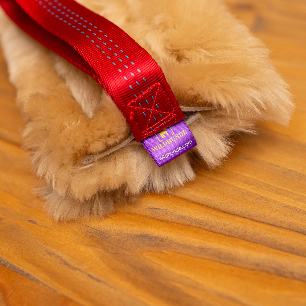 Wild-Tug Long Sheepskin Squeaker Tug Toy with Drag Line Bungee