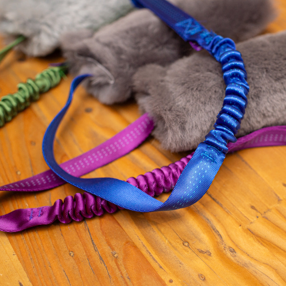 Wild-Tug Long Sheepskin Squeaker Tug Toy with Drag Line Bungee